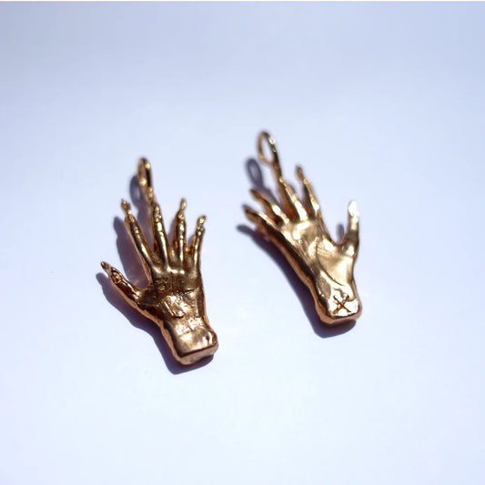 Hand of glory charm, bronze
