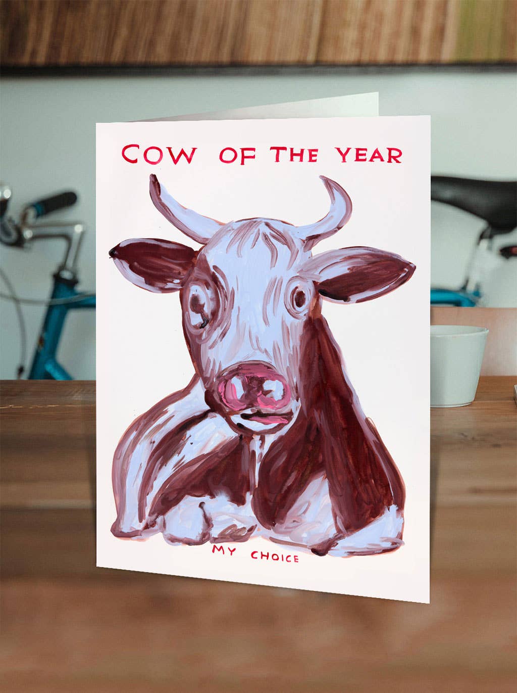 Cow Of The Year Greetings Card by David Shrigley
